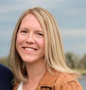 Woman with shoulder length blond hair.